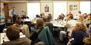 Photo of an FHWA training in progress showing an instructor in front of a classroom of students.