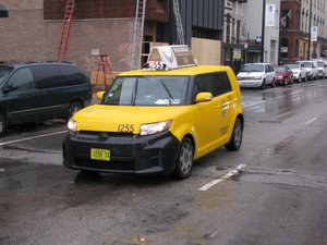 Yellow Cab Scion xB
