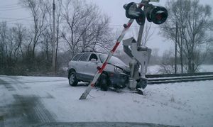 Car Crash at Railroad Crossing