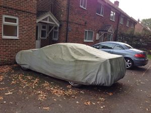 Car under a tarp