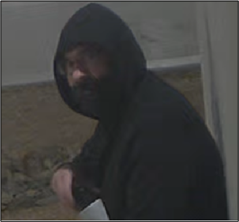 Man in black hoodie.