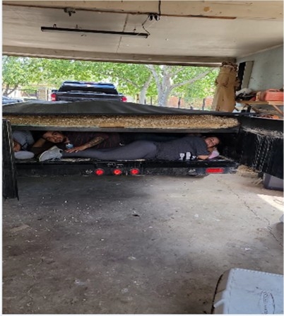 Smuggling Tow-Behind Trailer A “tow-behind” trailer used by the organization to smuggle illegal aliens from Eagle Pass to San Antonio. The trailers were custom made by Alien Smuggling Organization member, Evan John Herrera, to conceal the illegal aliens in route.