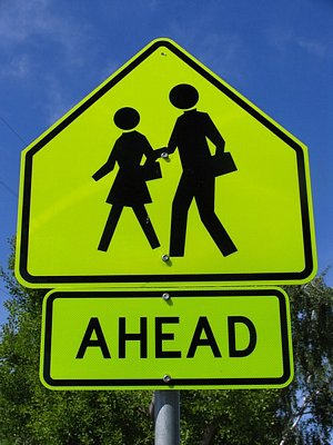 school crossing ahead sign